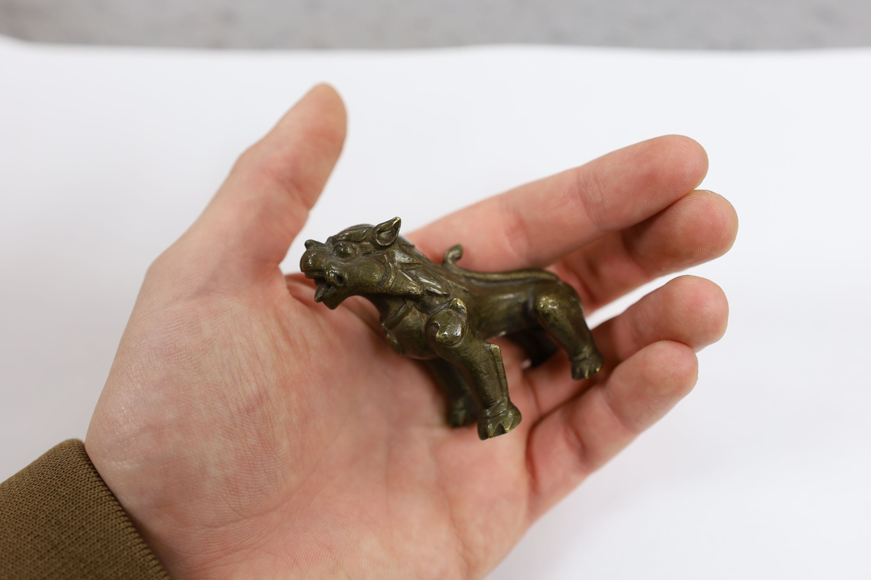 Five Chinese or Tibetan bronze figures or Buddhist implements, tallest 13cms high